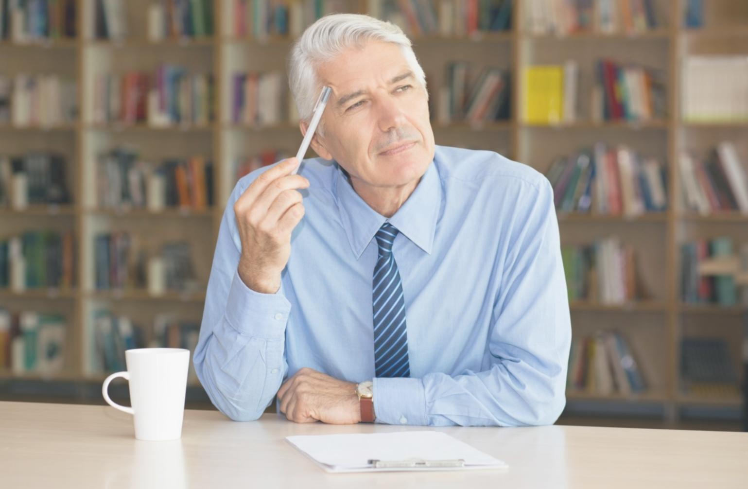 Person reviewing financial documents and budgeting materials